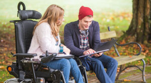Support Coordinator assisting an NDIS participant with their plan, offering guidance and emotional support